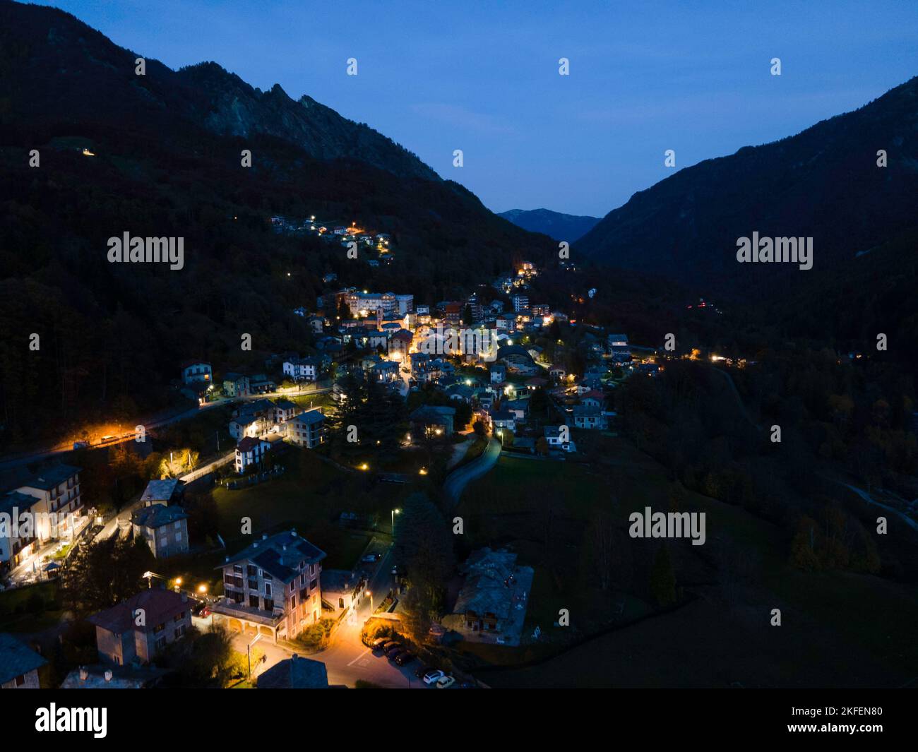 An aerial view of a small Italian village in the mountain at blue hour ...