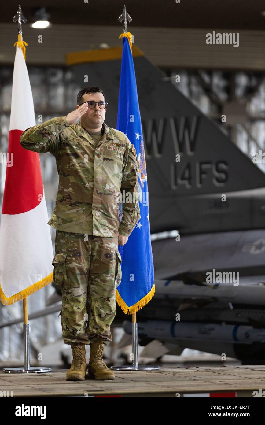 U.S. Air Force Maj. Christopher Alfonso, incoming 14th Fighter Generation Squadron (FGS) commander, renders his first salute to the newly activated 14th FGS during a squadron activation ceremony at Misawa Air Base, Japan, Sept. 13, 2022. The 14th FGS will work closely with the 14th Fighter Squadron, producing an agile squadron of F-16 Fighting Falcons for the defense of Japan and U.S. interests in the U.S. Indo-Pacific Command area of responsibility. Stock Photo