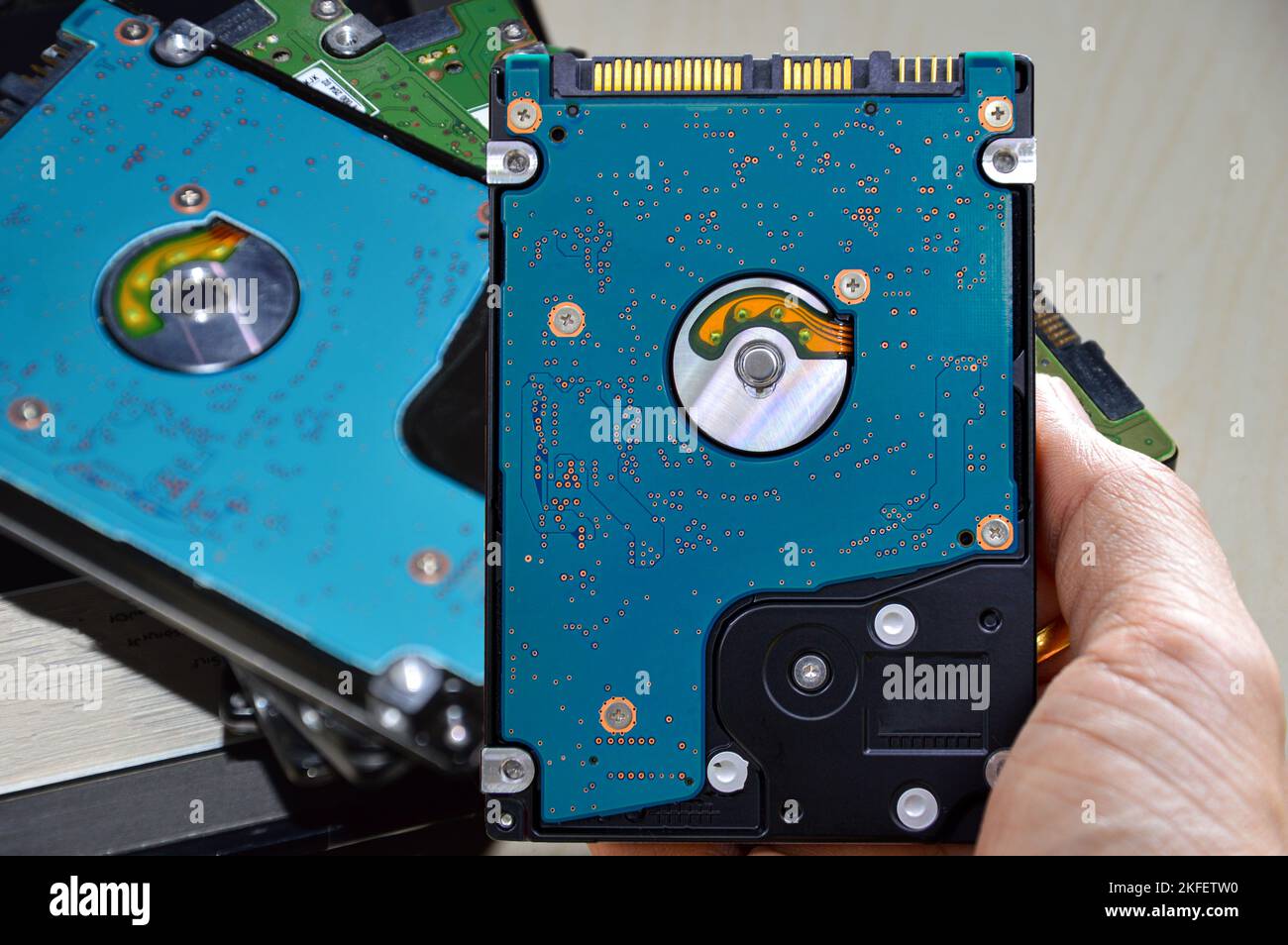 Hard disk drives are still widely used. hard drive in hand Stock Photo