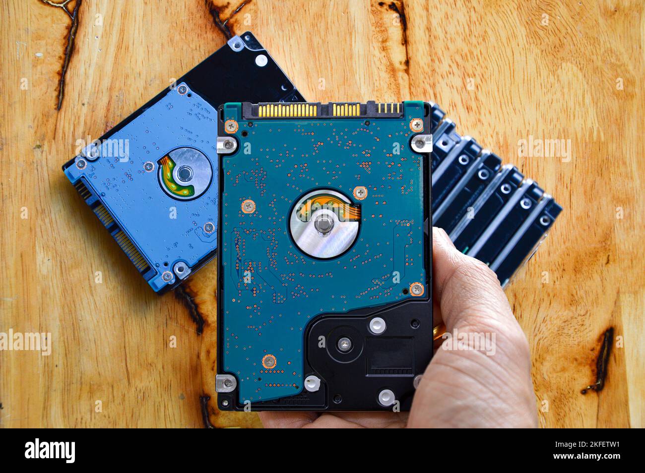 Hard disk drives are still widely used. hard drive in hand Stock Photo