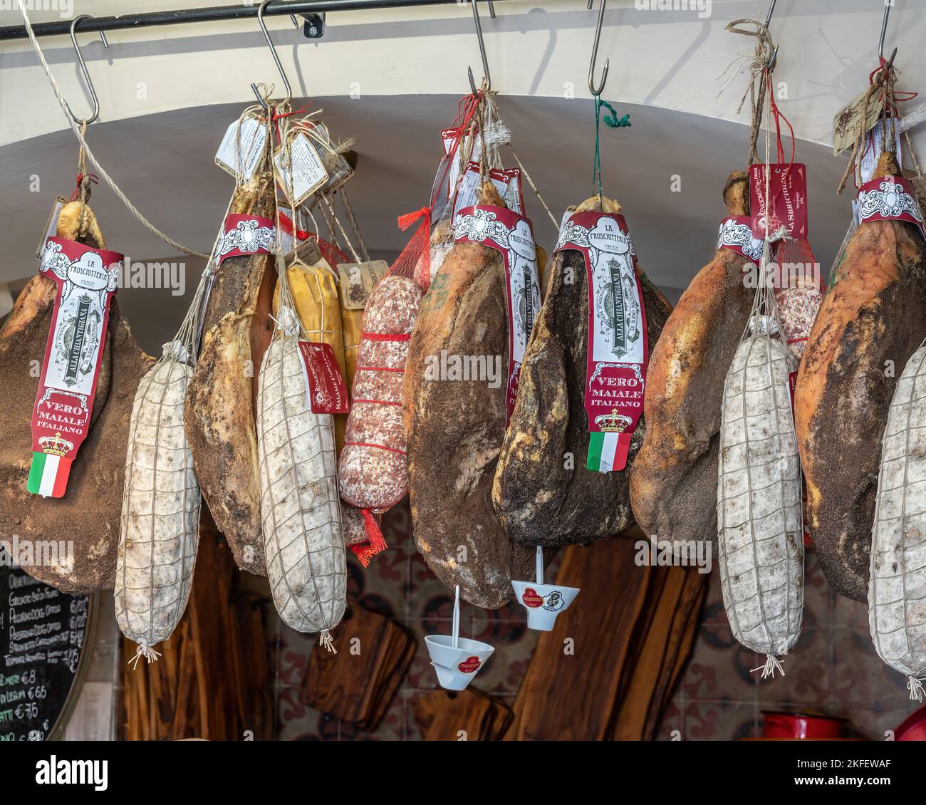 Cured meats and sausages hung to dry in a shop in Perugia. Perugia