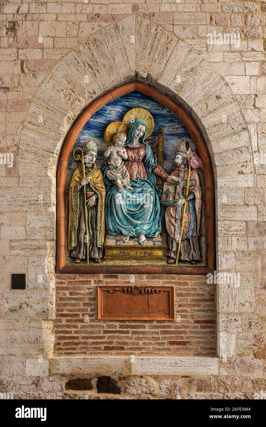 The ceramic Maestà by Germano Belletti replaces the original painting transferred to the Bishopric. Represents the Madonna seated on the throne. Stock Photo