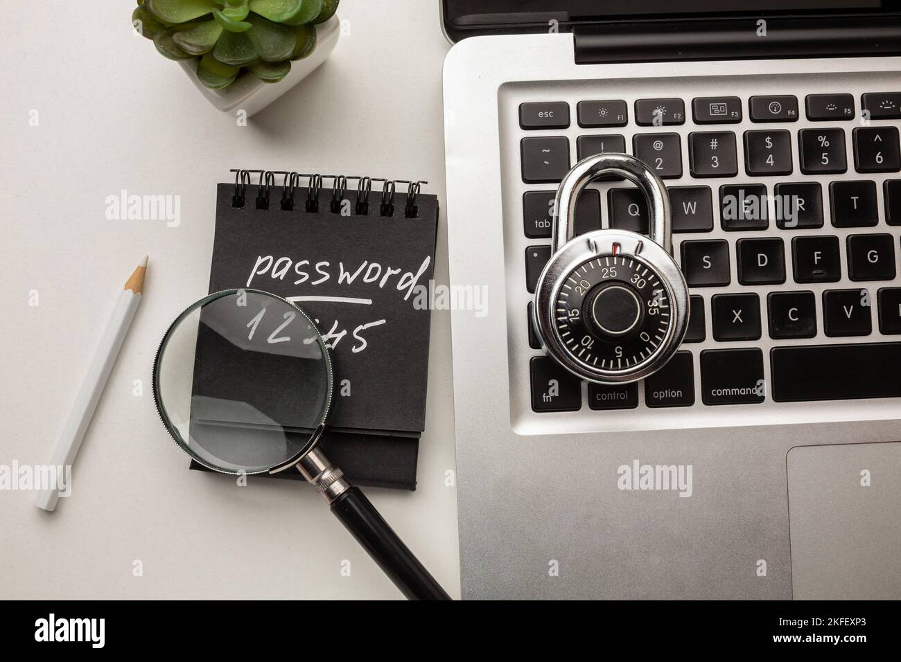 Strong steel coded lock on a laptop keyboard. IT security policies