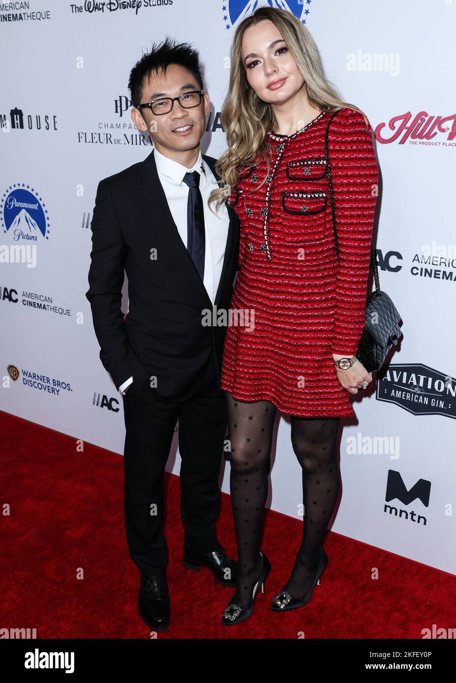 BEVERLY HILLS, LOS ANGELES, CALIFORNIA, USA - NOVEMBER 17: Australian director James Wan and partner/Romanian actress Ingrid Bisu arrive at the 36th Annual American Cinematheque Awards Honoring Ryan Reynolds held at The Beverly Hilton Hotel on November 17, 2022 in Beverly Hills, Los Angeles, California, United States. (Photo by Xavier Collin/Image Press Agency) Stock Photo