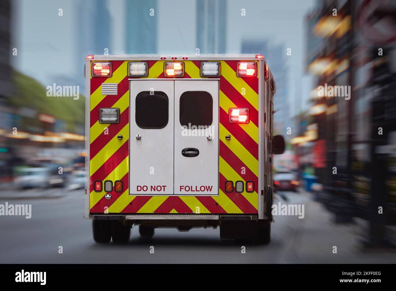 Ambulance car of emergency medical service on urban street. Themes rescue, urgency and health care. Stock Photo