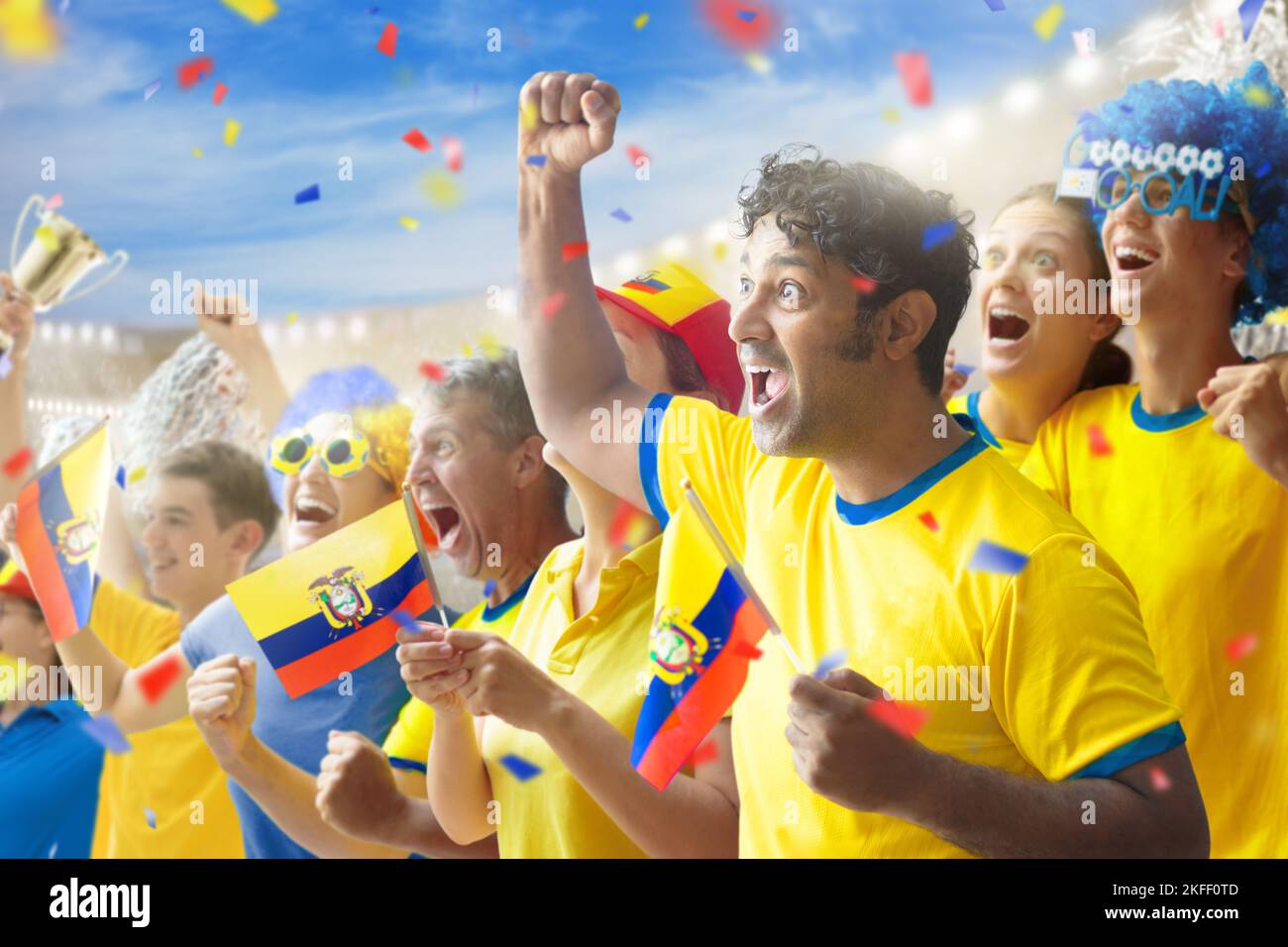 Ecuador football supporter on stadium. Ecuadorian fans on soccer pitch watching team play. Group of supporters with flag and national jersey Stock Photo