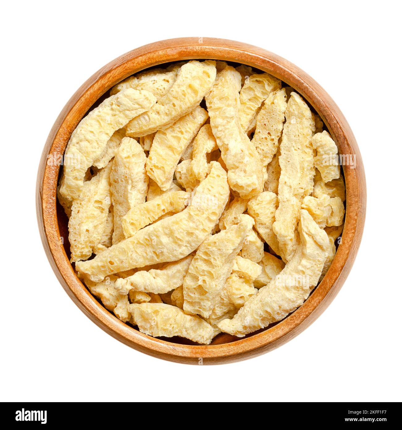 Soy curls, a soy based meat alternative, in a wooden bowl. Soya chunks