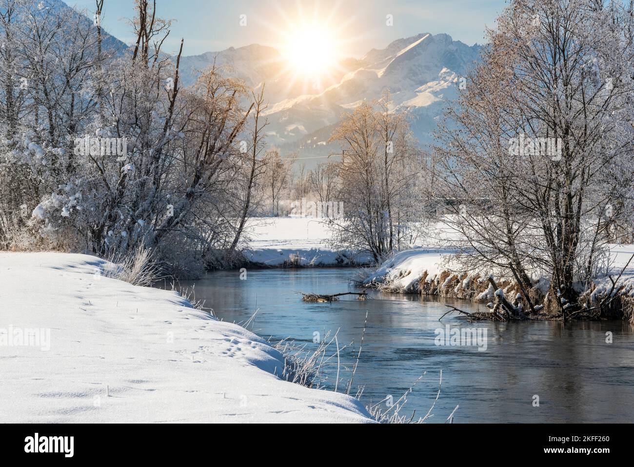 landscape in winter with mountain range and river Stock Photo