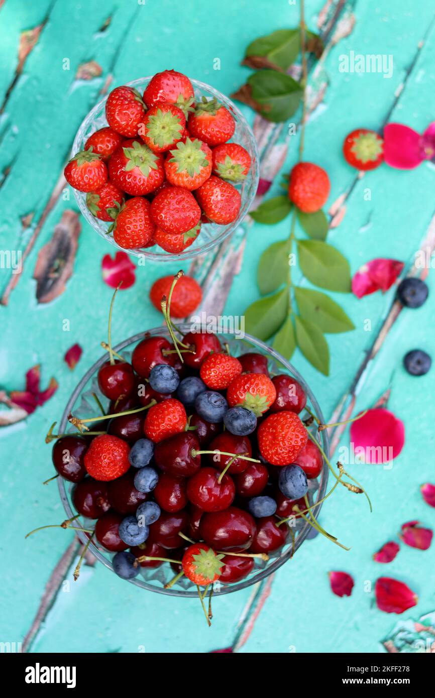 Simple composition still life photo with fresh berries. Seasonal fruit close up photo. Eating healthy concept. Stock Photo