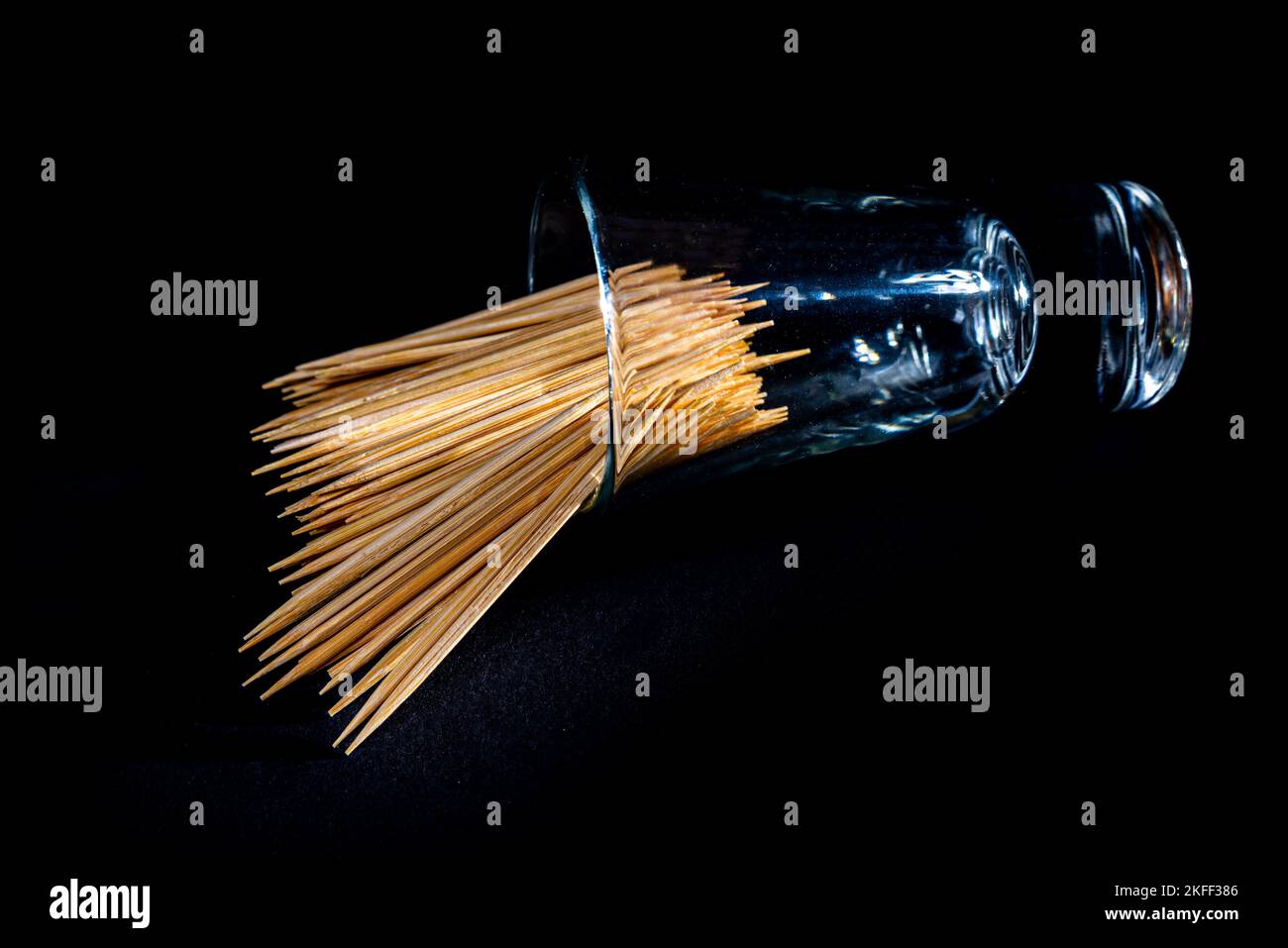 bamboo wooden toothpicks in glass jar, wine glass. in bucket