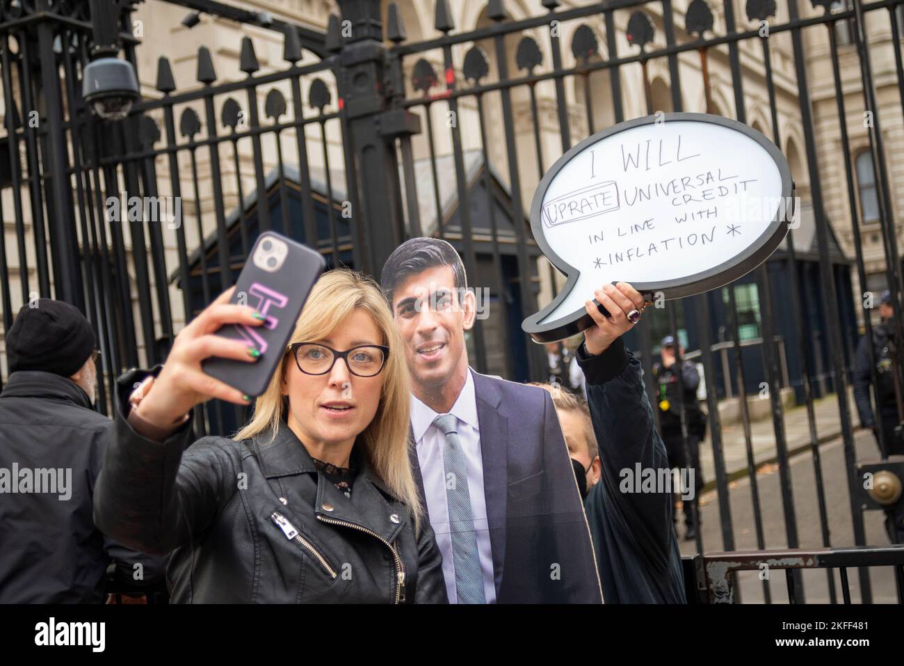 Protest outside Downing Street putting a speech bubble to a Rishi Sunak cut-out quoting 'I will uprate Universal Credit in line with inflation' Stock Photo