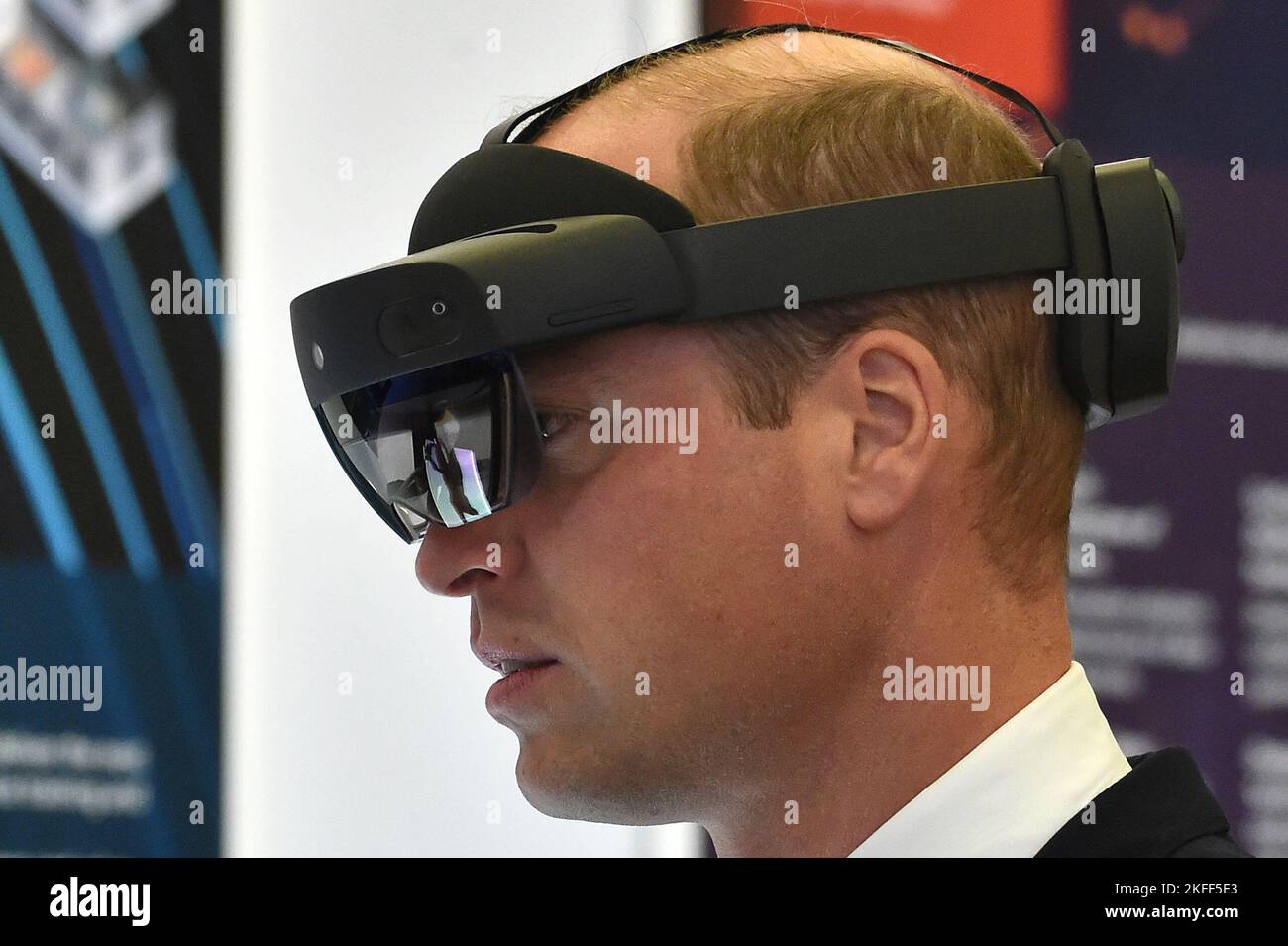 The Prince of Wales wears a pair of AR goggles, used by Typhoon aircraft pilots whilst visiting a Typhoon maintenance hanger during a visit to RAF Coningsby, Lincolnshire, to learn about future technological innovations and open a new boxing club. Picture date: Friday November 18, 2022. Stock Photo