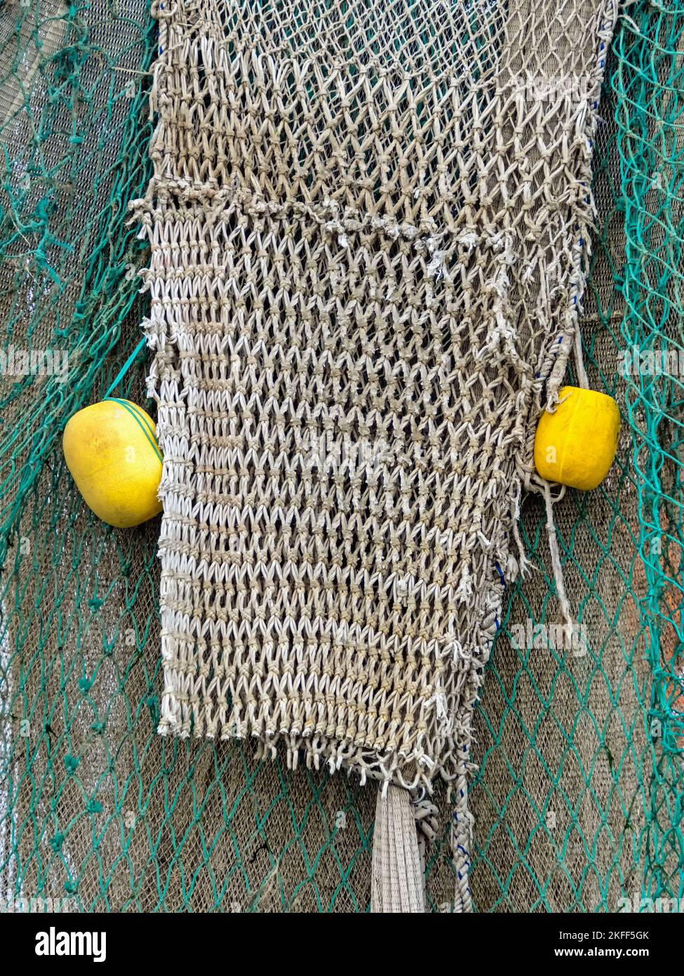 Fishing net with yellow floats as maritime background Stock Photo Alamy