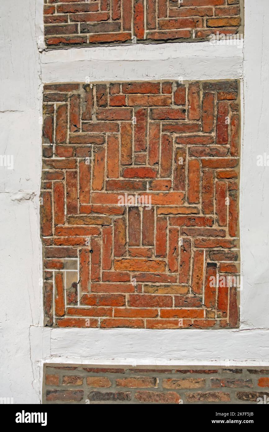 Close up of half-timbered brick with white beams as background Stock Photo