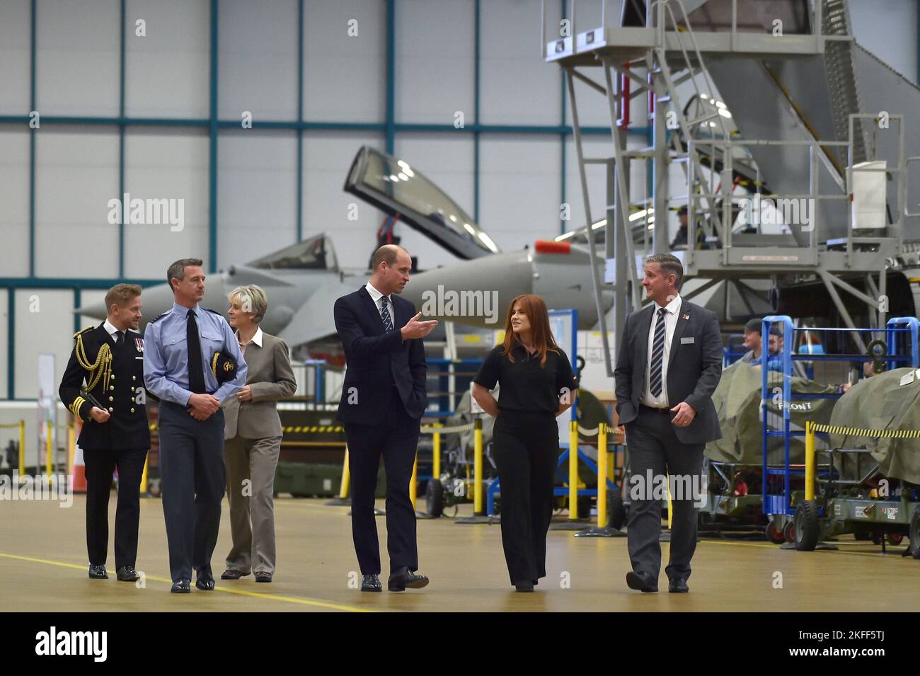 The Prince of Wales meets staff as he tours a Typhoon maintenance hanger during a visit to RAF Coningsby, Lincolnshire, to learn about future technological innovations and open a new boxing club. Picture date: Friday November 18, 2022. Stock Photo