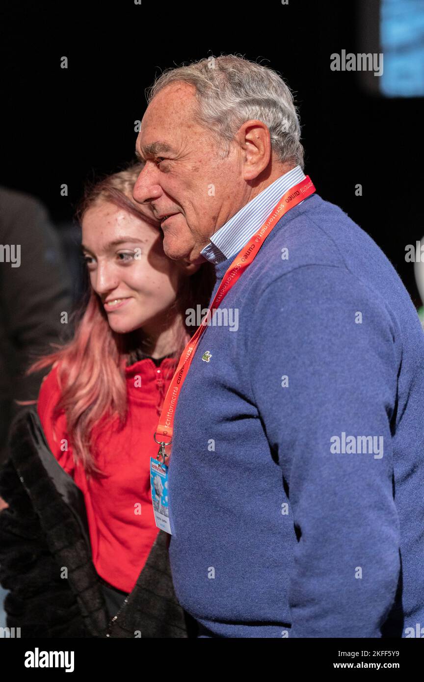 Cuneo, Italy. 18th November 2022. The former anti-mafia magistrate and former president of the Senate of the Italian Republic Pietro Grasso posing with a student during the presentation of his latest book, dedicated to Giovanni Falcone, at the XXIV edition of the Scrittorincittà Festival. Credit: Luca Prestia / Alamy Live News Stock Photo