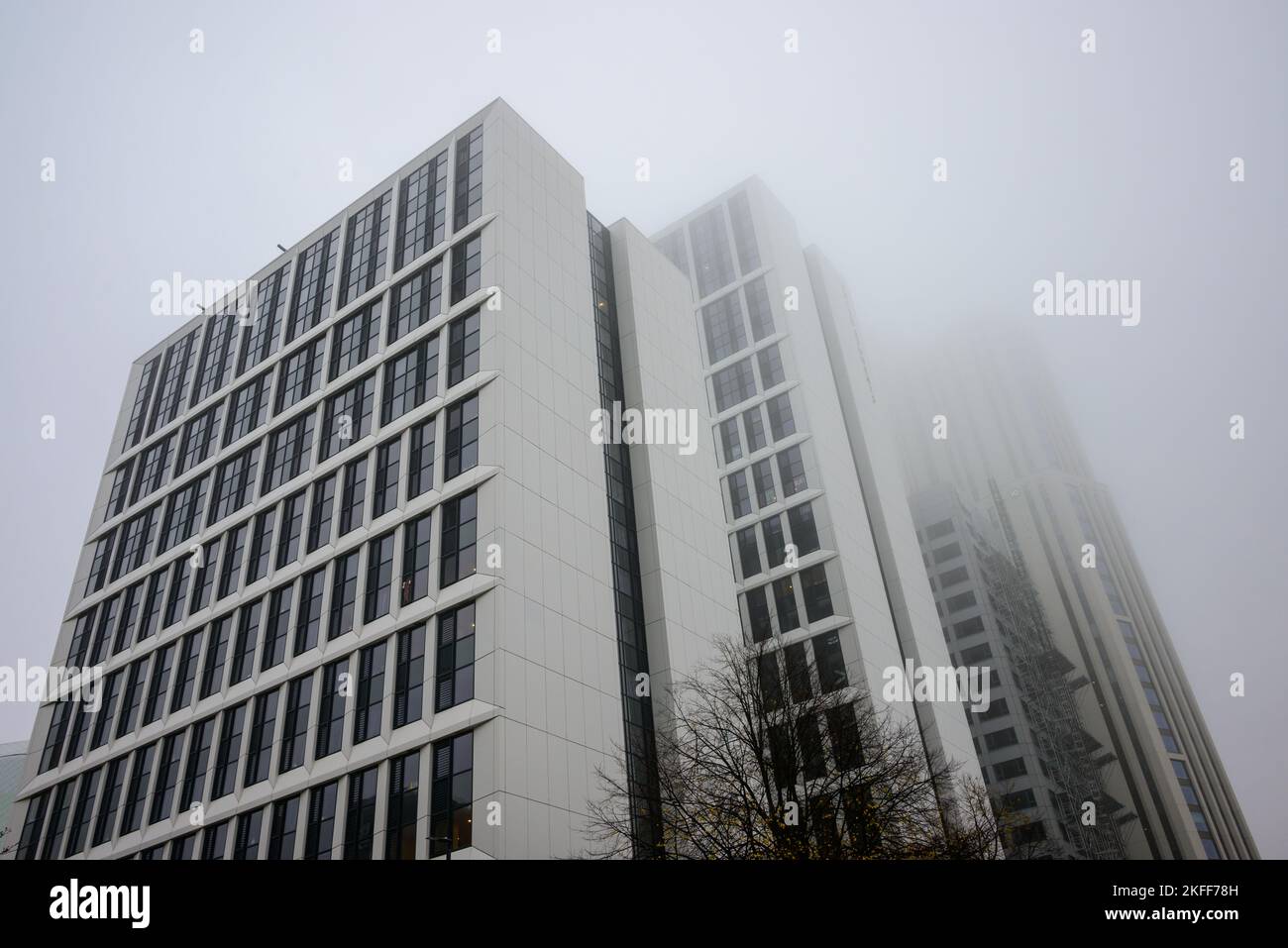 White tower blocks of Arena Point disappearing into low cloud and mist, Merrion Way, Leeds, West Yorkshire, UK Stock Photo