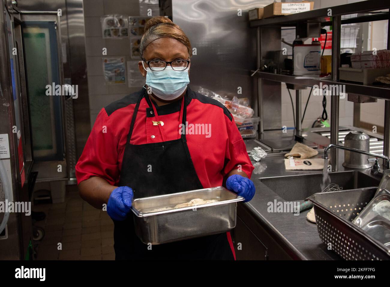 Fifi McGhee-Dennis prepares food for Patient Room Service at Brooke Army Medical Center, Fort Sam Houston, Texas, Sep. 14, 2022. BAMC’s Department of Nutritional Medicine is the Defense Health Agency’s premier dining facility thanks to its robust and diverse staff working behind the scenes every day to provide healthy and delicious meals to BAMC’s staff, patients, and visitors. Stock Photo