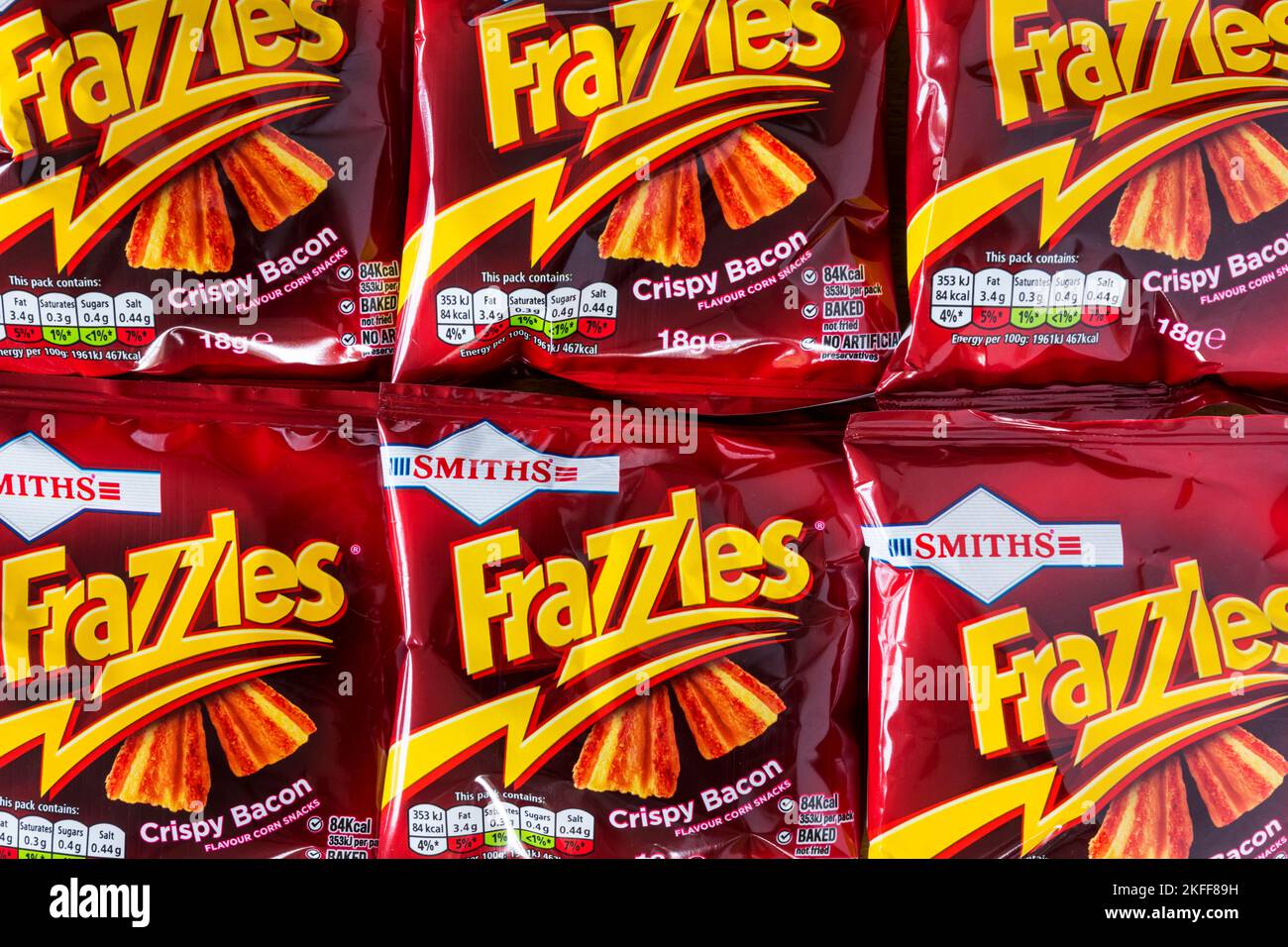 Packets of crispy bacon flavour Frazzles, made by Smiths. Stock Photo