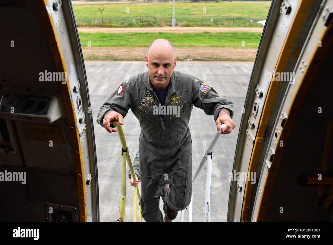 Reserve Deputy Commander Rear Adm. Brad Dunham, Commander, Naval Air Force Reserve, enters the P-3C Orion for his final flight with Patrol Squadron (VP) 69 at Ault Field in Oak Harbor, Washington September 14, 2022. VP-69, a Navy reserve squadron, is slated to complete their transition to P-8 Poseidon aircraft later this year, sundowning the P-3C Orion for Navy operational squadrons. (U.S Navy Photo by Mass Communication Specialist 2nd class Aranza Valdez) Stock Photo