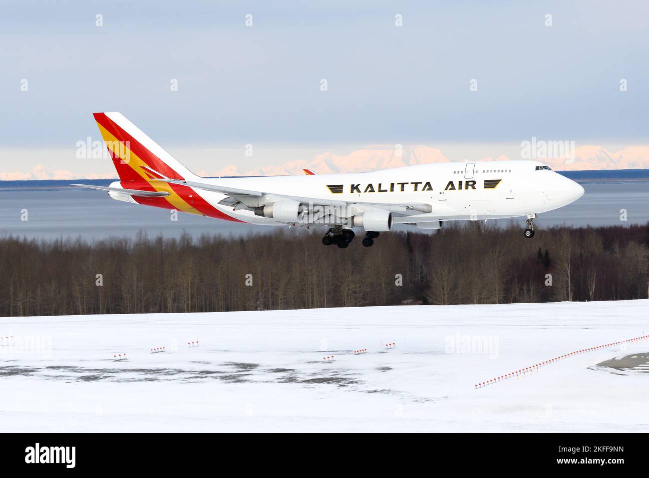 Kalitta Air Cargo Boeing 747 freighter plane landing. Large cargo airplane 747-400F. Aircraft 747F arrival in at snow covered Anchorage Airport. Stock Photo