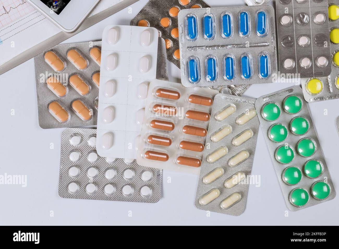 There are many different types of pills on table with in medical office doctor Stock Photo