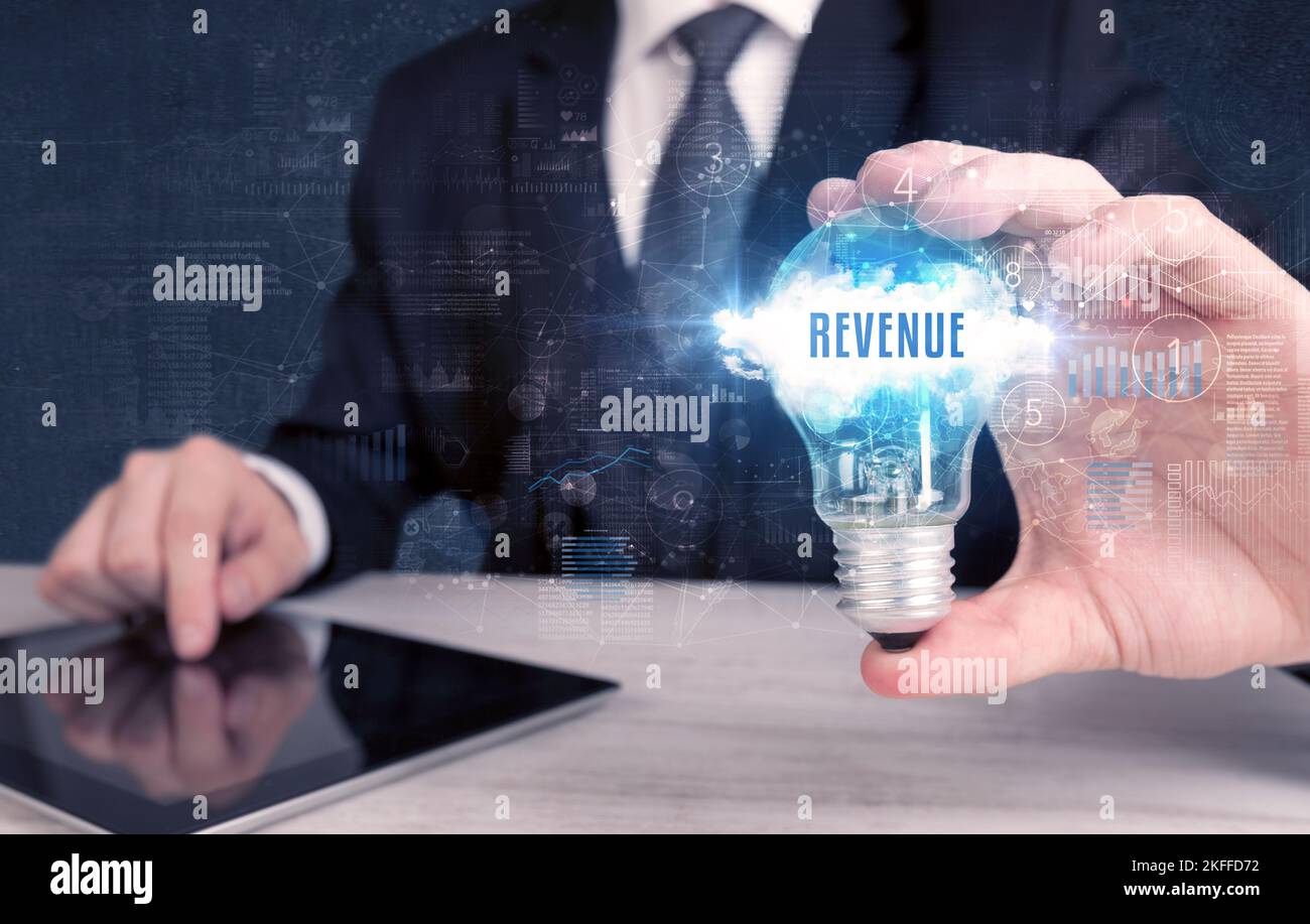 Businessman holding a light bulb, business concept Stock Photo - Alamy
