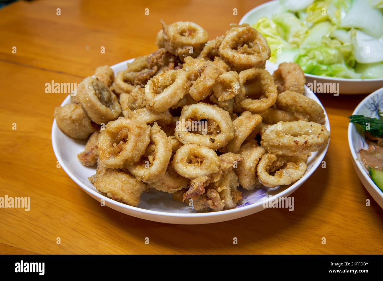 A golden and tempting deep-fried crispy squid ring Stock Photo