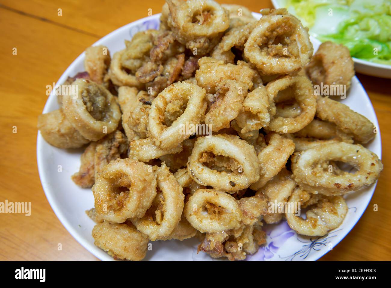A golden and tempting deep-fried crispy squid ring Stock Photo