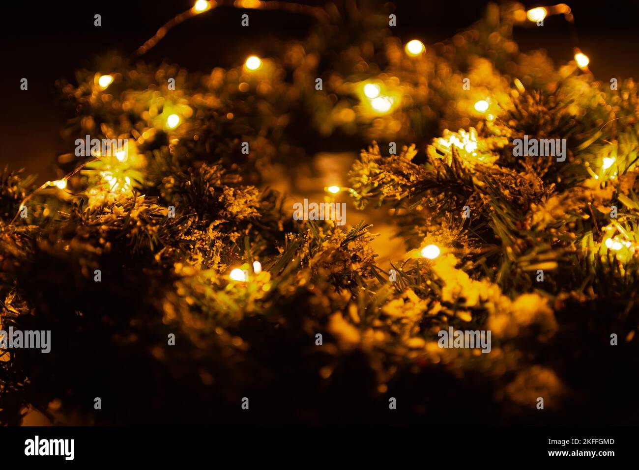 Christmas wreath with lights garland for door Stock Photo Alamy