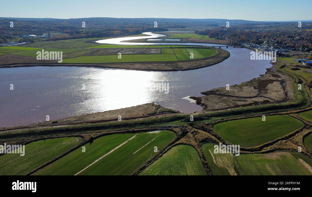 An aerial view of a lake in the green field Stock Photo - Alamy