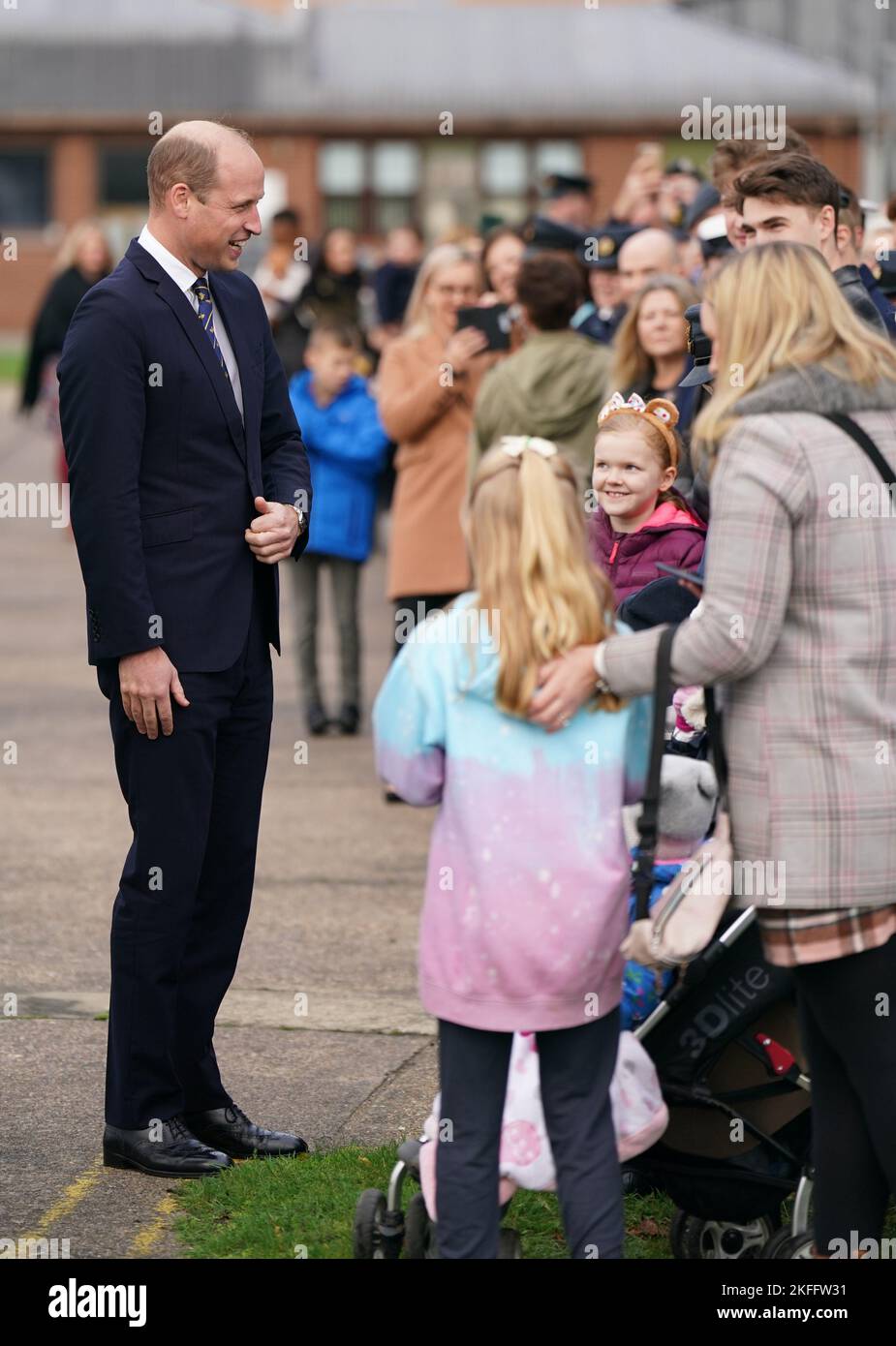 The Prince of Wales meeting family members of RAF personnel during a visit to RAF Coningsby, Lincolnshire, to learn about future technological innovations and open a new boxing club. Picture date: Friday November 18, 2022. Stock Photo
