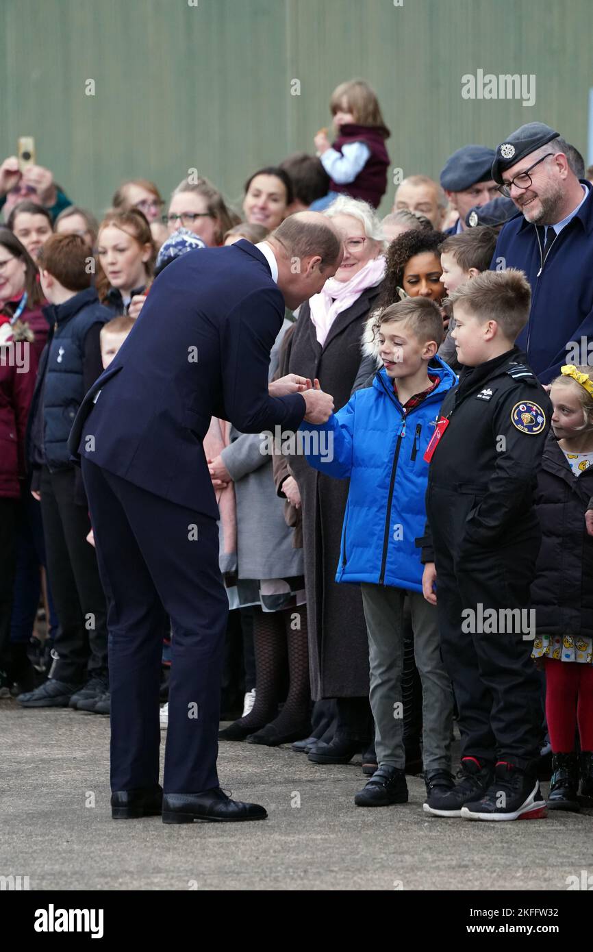 The Prince of Wales meeting family members of RAF personnel during a visit to RAF Coningsby, Lincolnshire, to learn about future technological innovations and open a new boxing club. Picture date: Friday November 18, 2022. Stock Photo