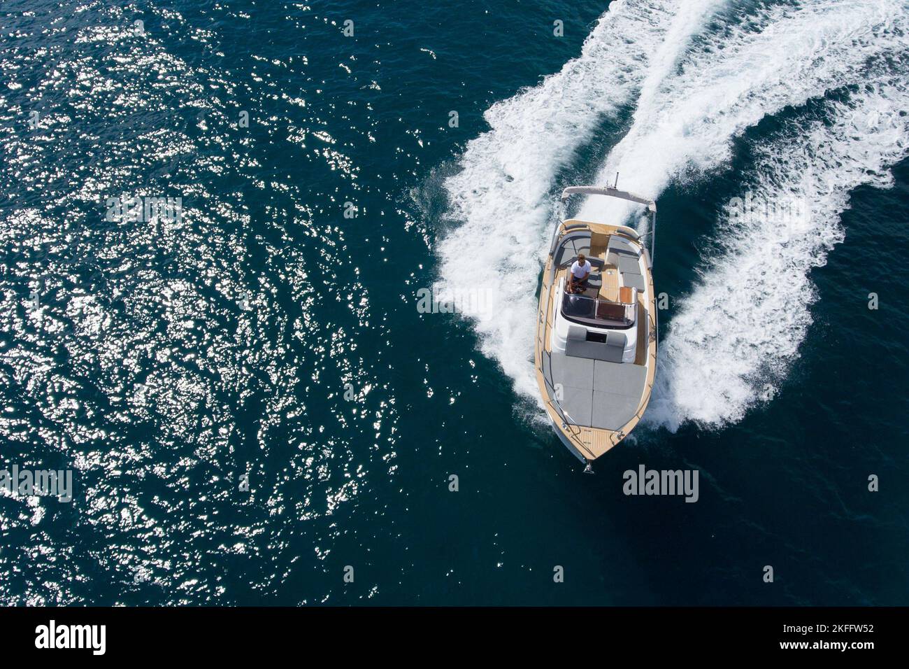 Drone top view of a small luxury boat sailing at high speed Stock Photo