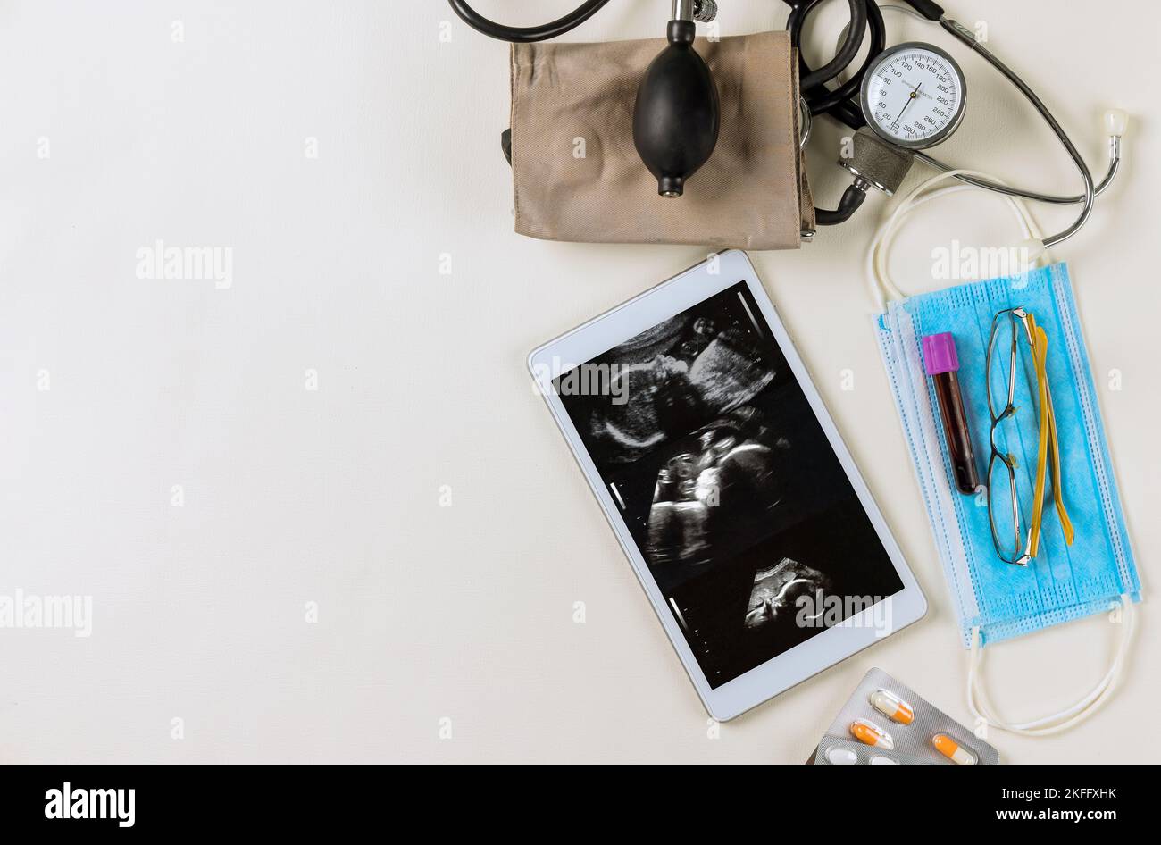 Doctor checks ultrasound of during pregnancy woman to prescribe