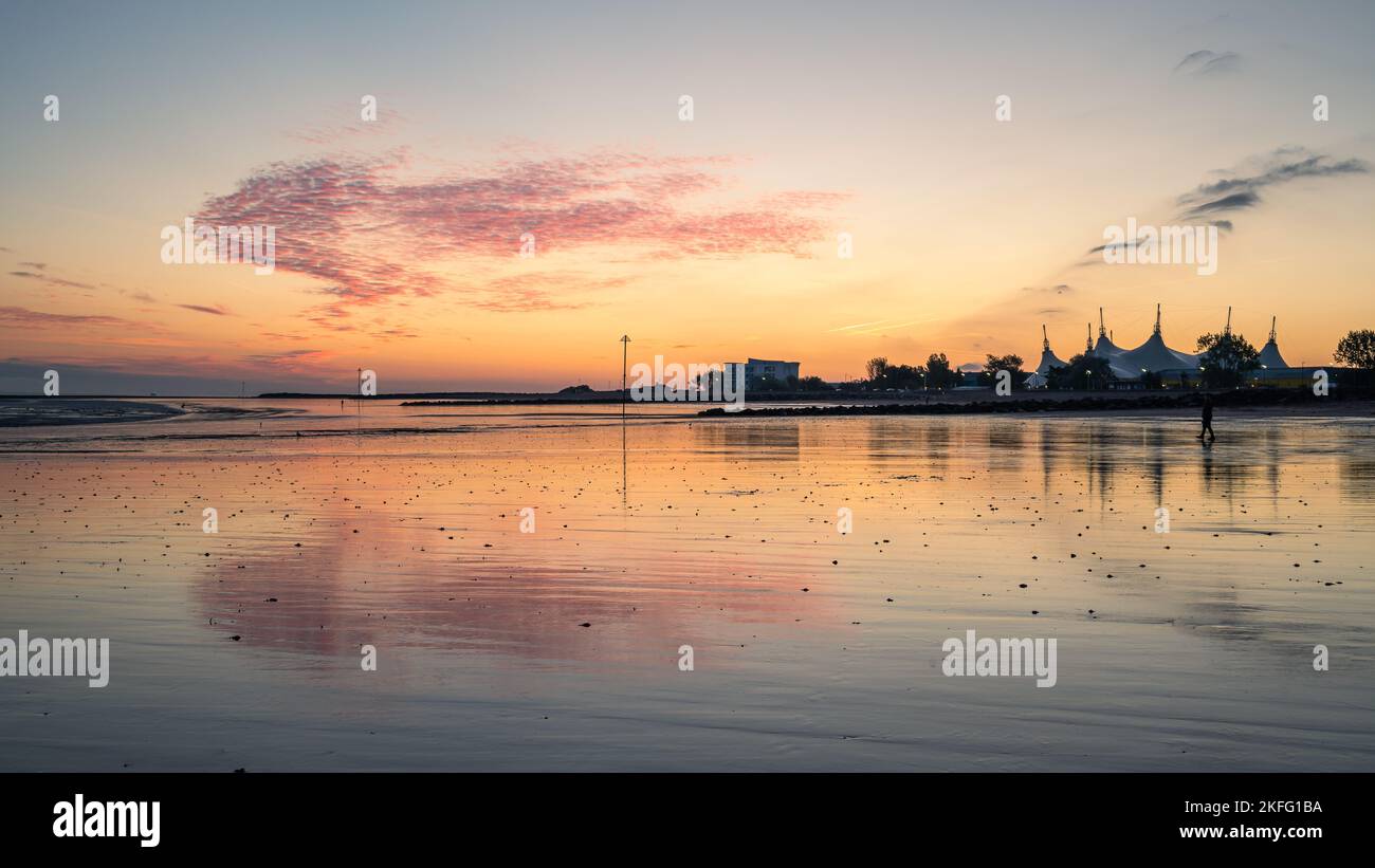 Sunset Butlins A silhouette of Butlins with the reflection on Minehead beach on the ...