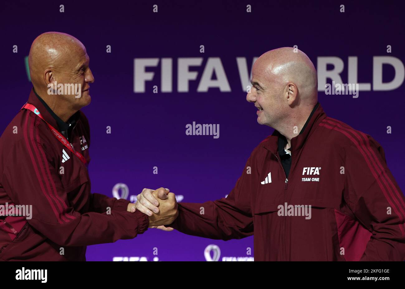 Doha, Qatar. 18th Nov, 2022. FIFA President Gianni Infantino (R) shakes hands with Pierluigi Collina, chairman of the FIFA Referees Committee, during a media briefing at 2022 Qatar World Cup Main Media Centre in Doha, Qatar, Nov. 18, 2022. Credit: Jia Haocheng/Xinhua/Alamy Live News Stock Photo