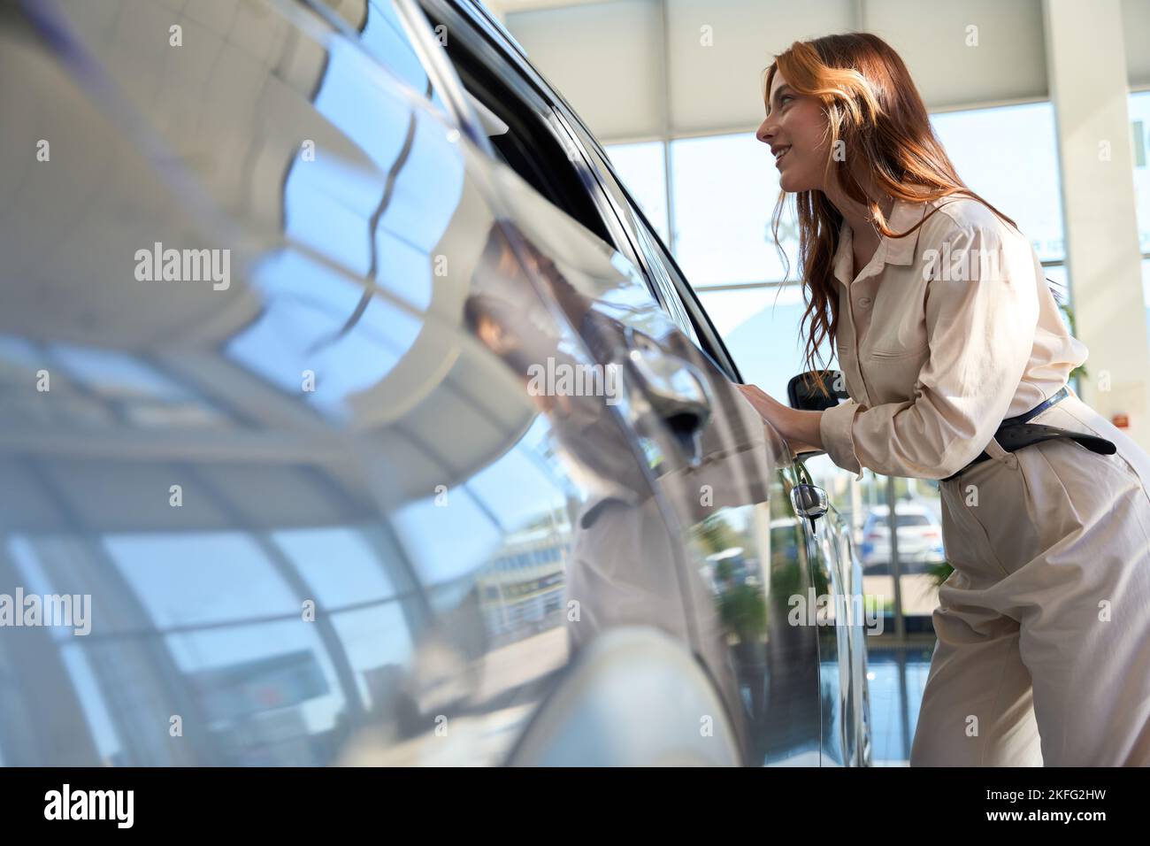 Vehicle shopper choosing new car at auto dealership Stock Photo - Alamy