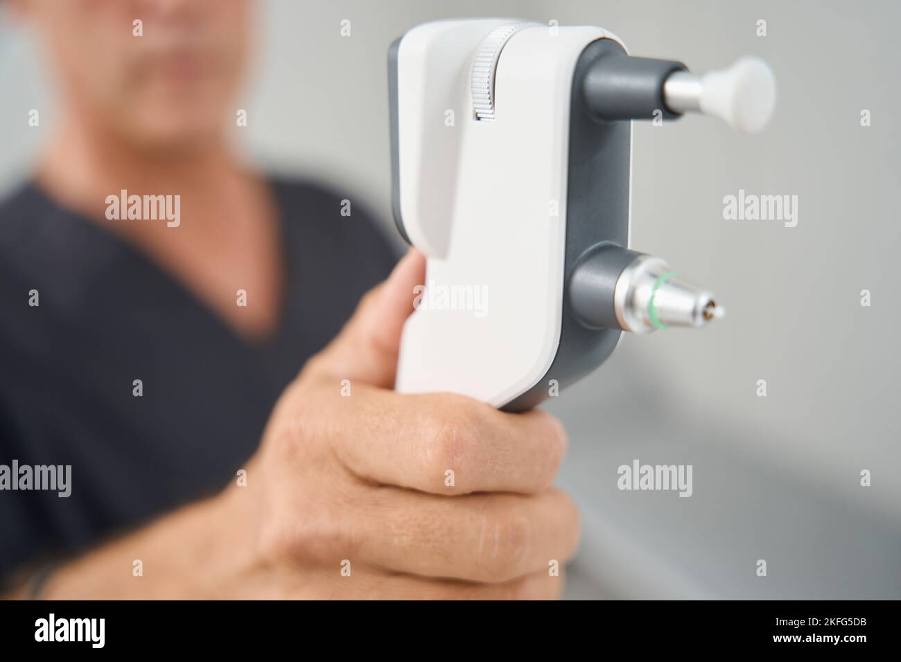 Close up photo of medical worker holding tonometer Stock Photo