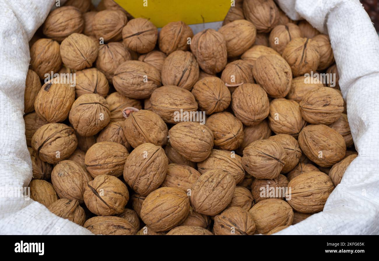 close up shelled walnut pile. pile of shelled walnuts in the sack Stock