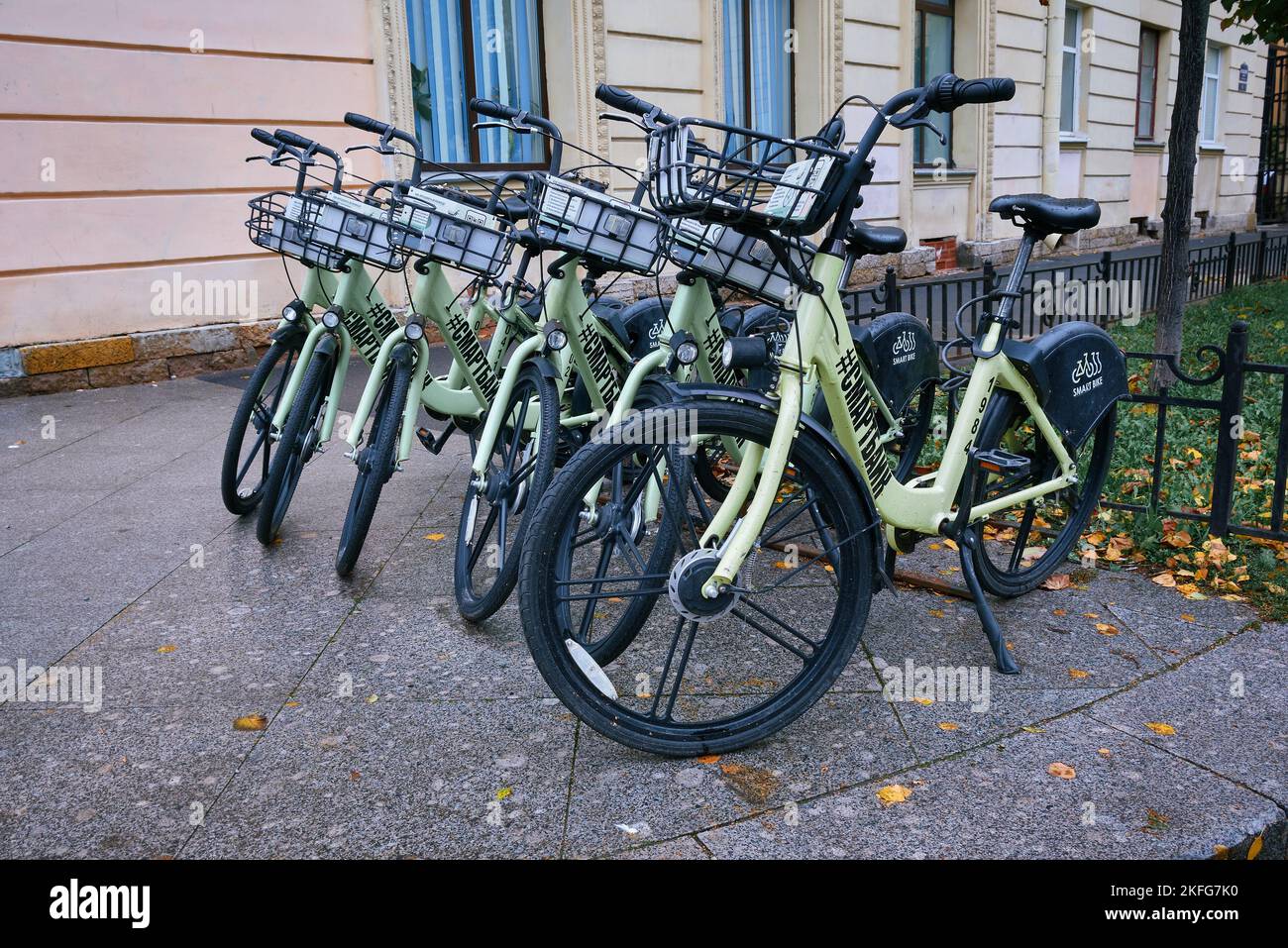 Rented bicycles on the sidewalk 6th Sovetskaya Street, an environmental public transportation: St. Petersburg, Russia - October 06, 2022 Stock Photo