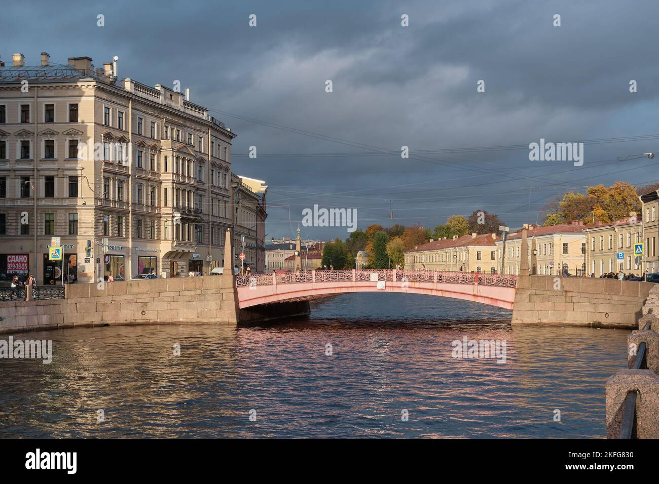 View of the Red Arch Bridge over the Moika River, built in 1814, landmark, cityscape: St. Petersburg, Russia - October 07, 2022 Stock Photo
