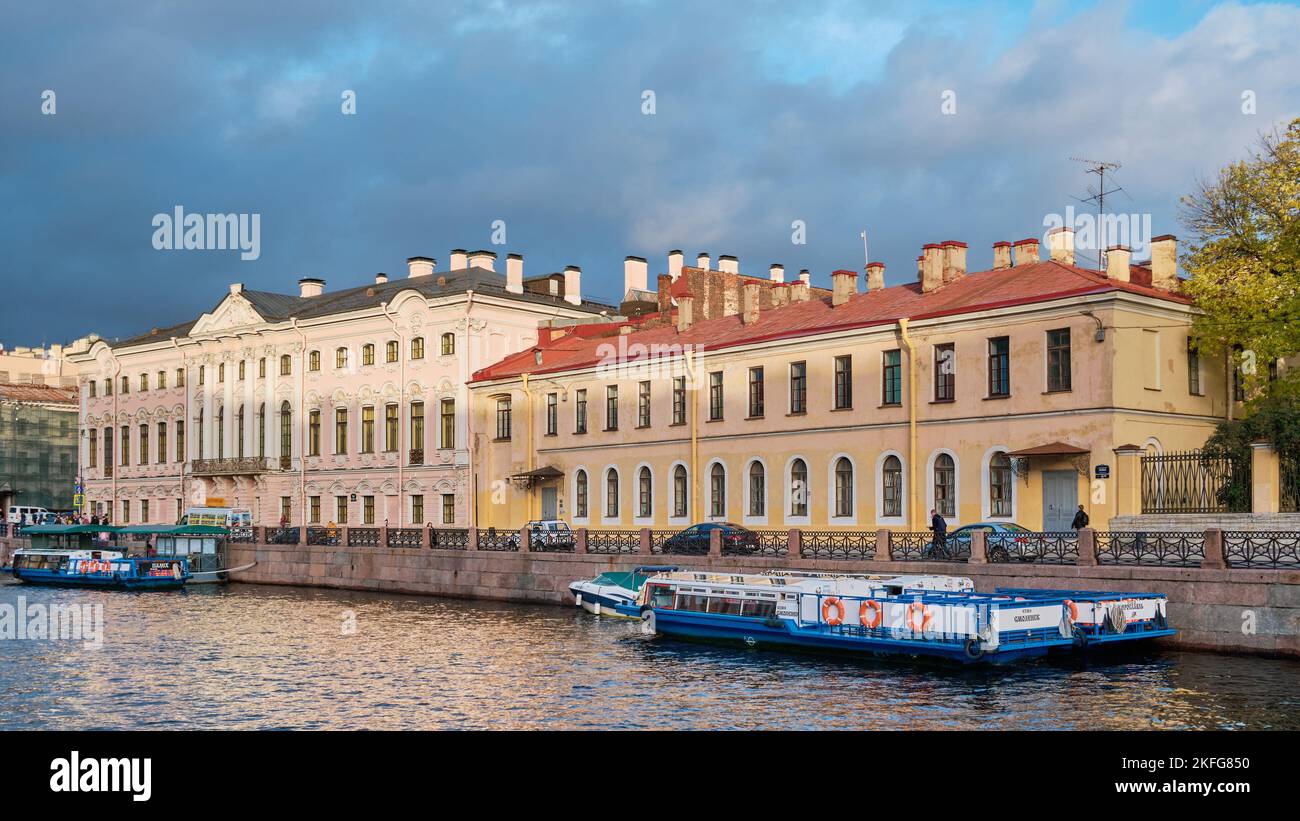 View of the Stroganov Palace and one of the buildings of the Herzen Pedagogical University, Moyka River Embankment, landmark: St. Petersburg, Russia - Stock Photo