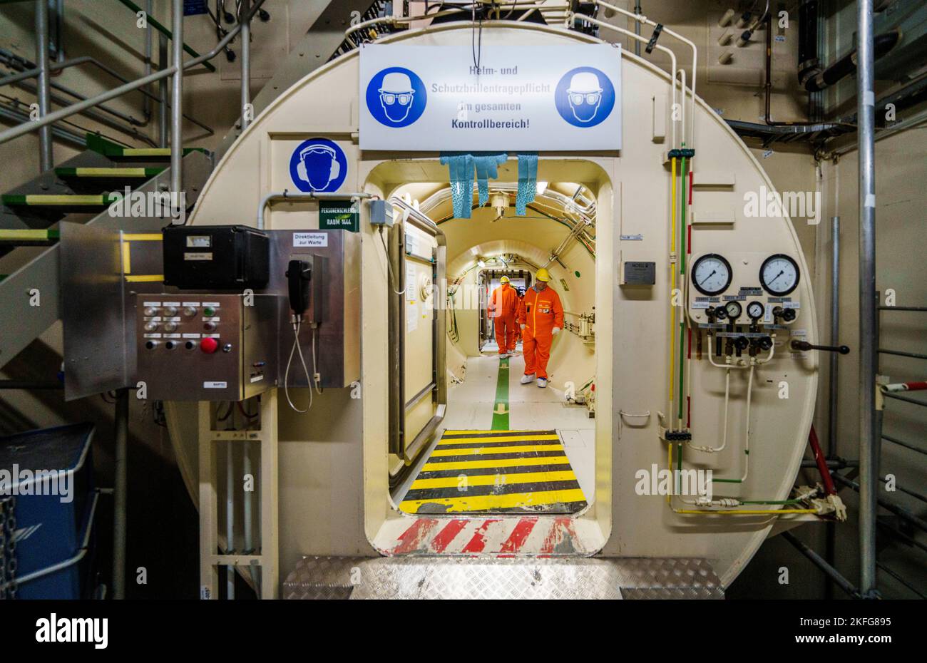 Biblis, Germany. 18th Nov, 2022. People walk through an airlock in a power plant unit. The Biblis nuclear power plant has been undergoing decommissioning since it was shut down. This process is expected to last until beyond 2030. Credit: Andreas Arnold/dpa/Alamy Live News Stock Photo