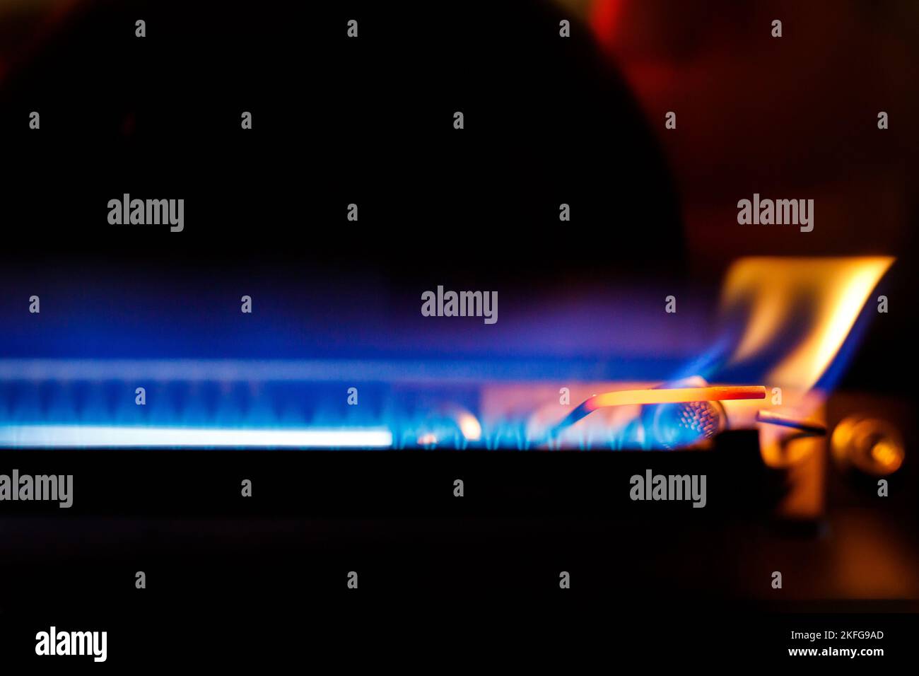 Gas boiler igniter. Gas is burning in the boiler. Stock Photo