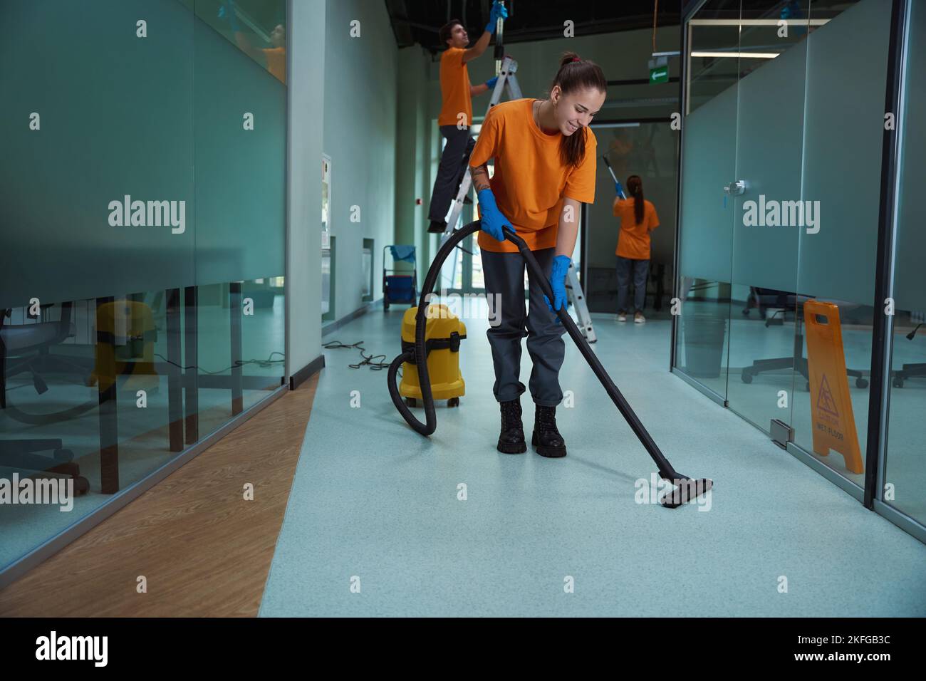 Cleaning company workers washing and cleansing the building Stock Photo