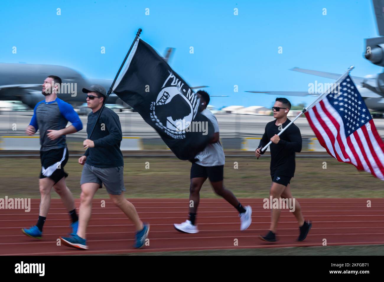 Airmen assigned to Joint Base Pearl Harbor-Hickam run in honor of POW/MIA week during a 24-hour run at Earhart Field on JBPHH, Hawaii, Sept. 15, 2022. The run and other scheduled events in the week were held in honor of more than 81,000 Americans who are still missing in action. Stock Photo