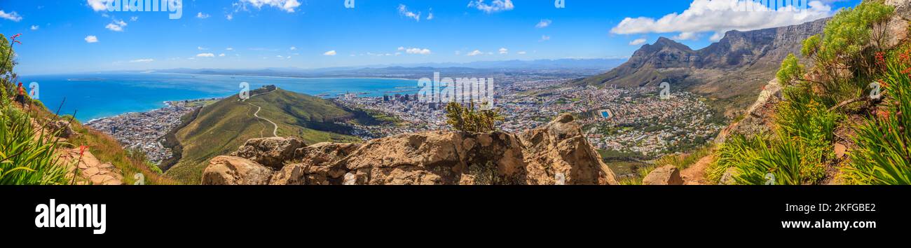 Photograph of Cape Town and Table Mountain from the ascent path to Lions Head during the day in bleuem sky with white clouds photographed in South Afr Stock Photo