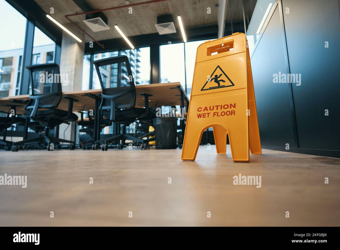 Warning sign caution, wet floor stands on the floor Stock Photo Alamy