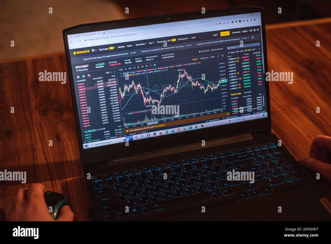 Tbilisi, Georgia - November 10, 2022: Bitcoin chart on Binance crypto exchange on Lenovo laptop's display. Stock Photo